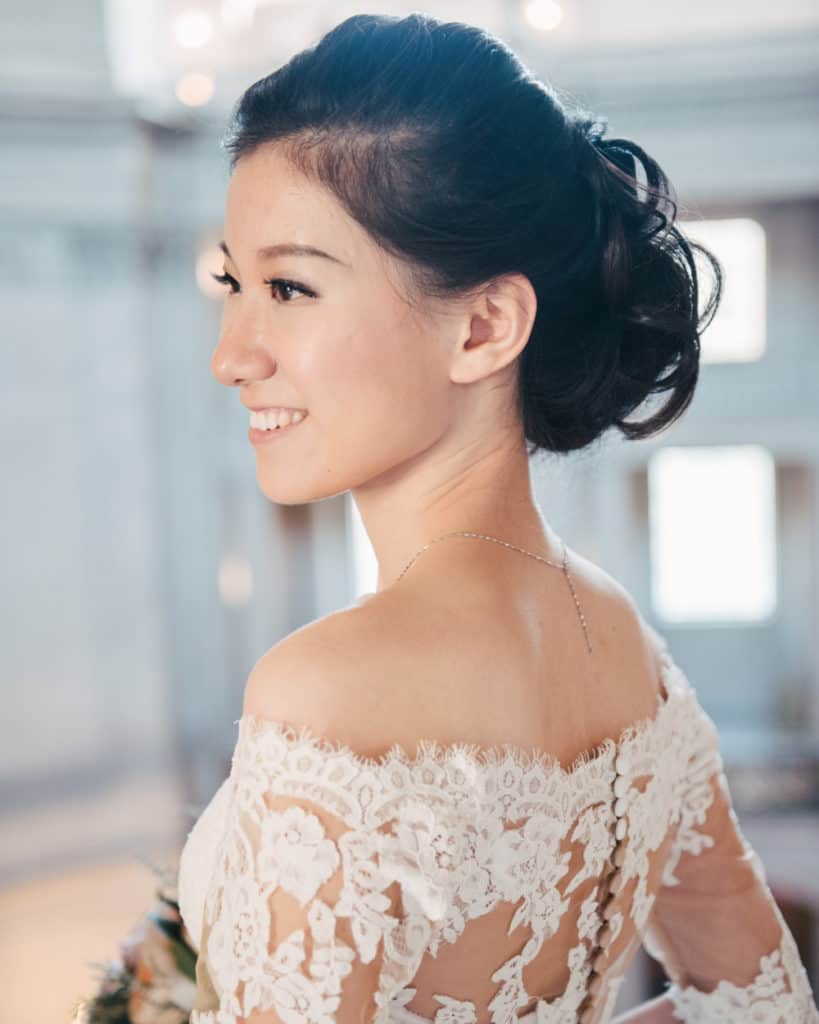 a bride with exposed shoulders dress posing